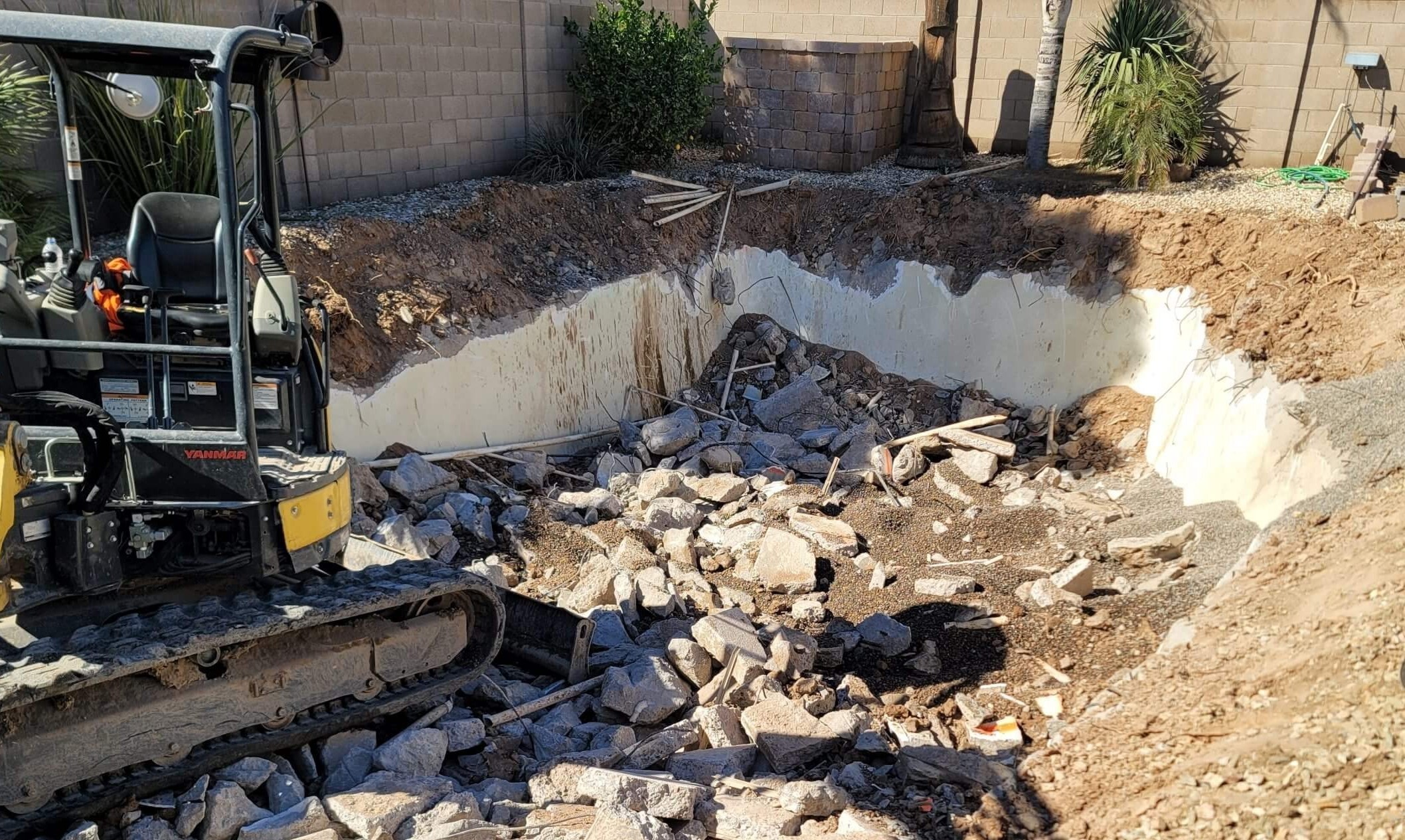 pool-demolition-in-progress-with-heavy-machinery